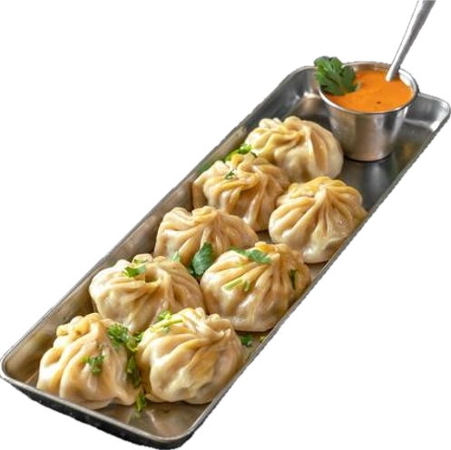 (8 pieces) (preparation time minimum 15 minutes steamed dumplings filled with minced chicken, onion, garlic, ginger and cilantro served with tomato chutney.